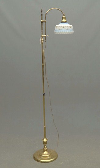 Brass Floor Lamp: Brass floor lamp with shade.