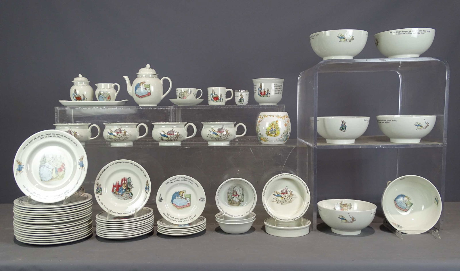 Wedgwood "Peter Rabbit" Dinner Set: Wedgwood "Peter Rabbit" dinner set including (18) 9 3/4" plates, (11) 7 3/4" plates, (6) 7" plates, (3) 5 3/4" bowls, (2) 6 3/4" soups, (6) 8" bowls, (4) 5" handled bowls (one chipped), 5" bowl, cream