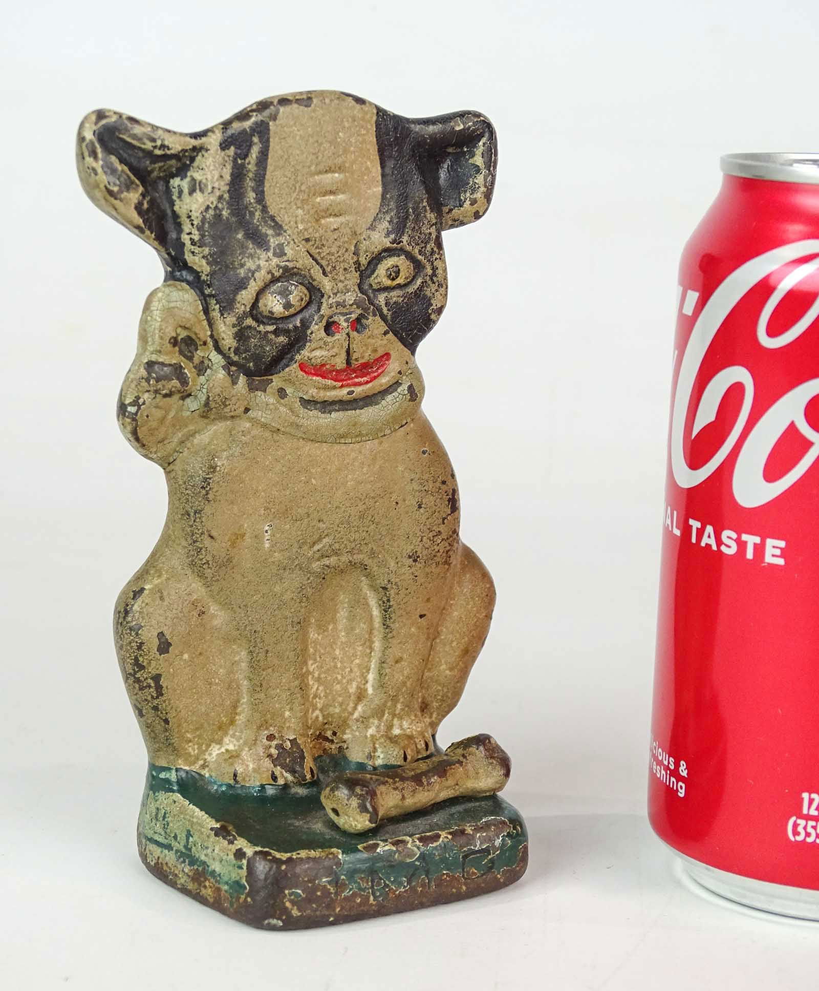 Antique Doorstop Hubley Dog: Boston Terrier Puppy Dog with bone by Grace Raynor for Hubley. Hand-painted cast iron doorstop. GHR and copyright 1921 insignia on back. 5 1/2" Ht..