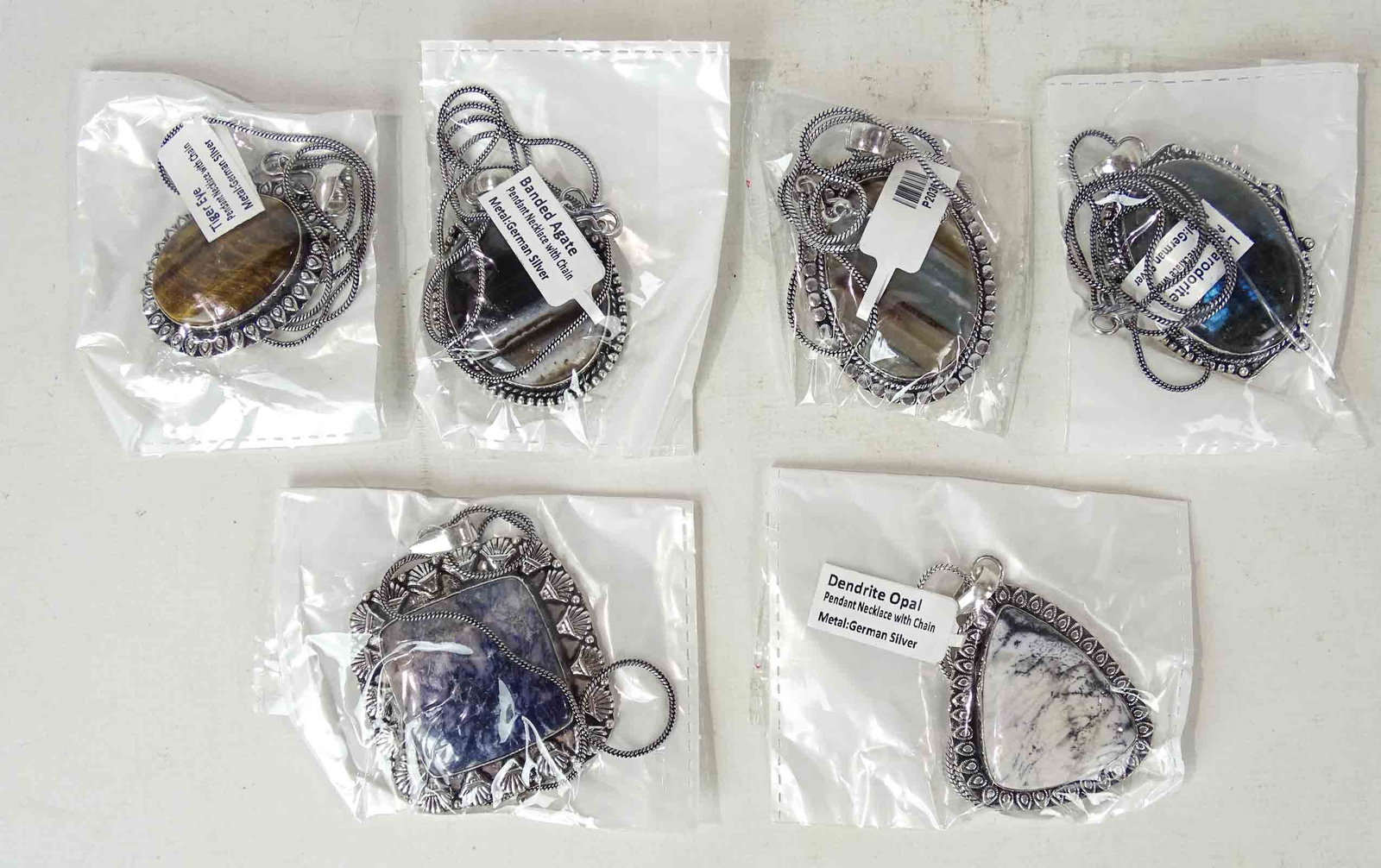 Necklaces with Stones: Lot (6) necklaces with stones. Includes Tiger Eye, Dendrite Opal, Banded Agate etc..