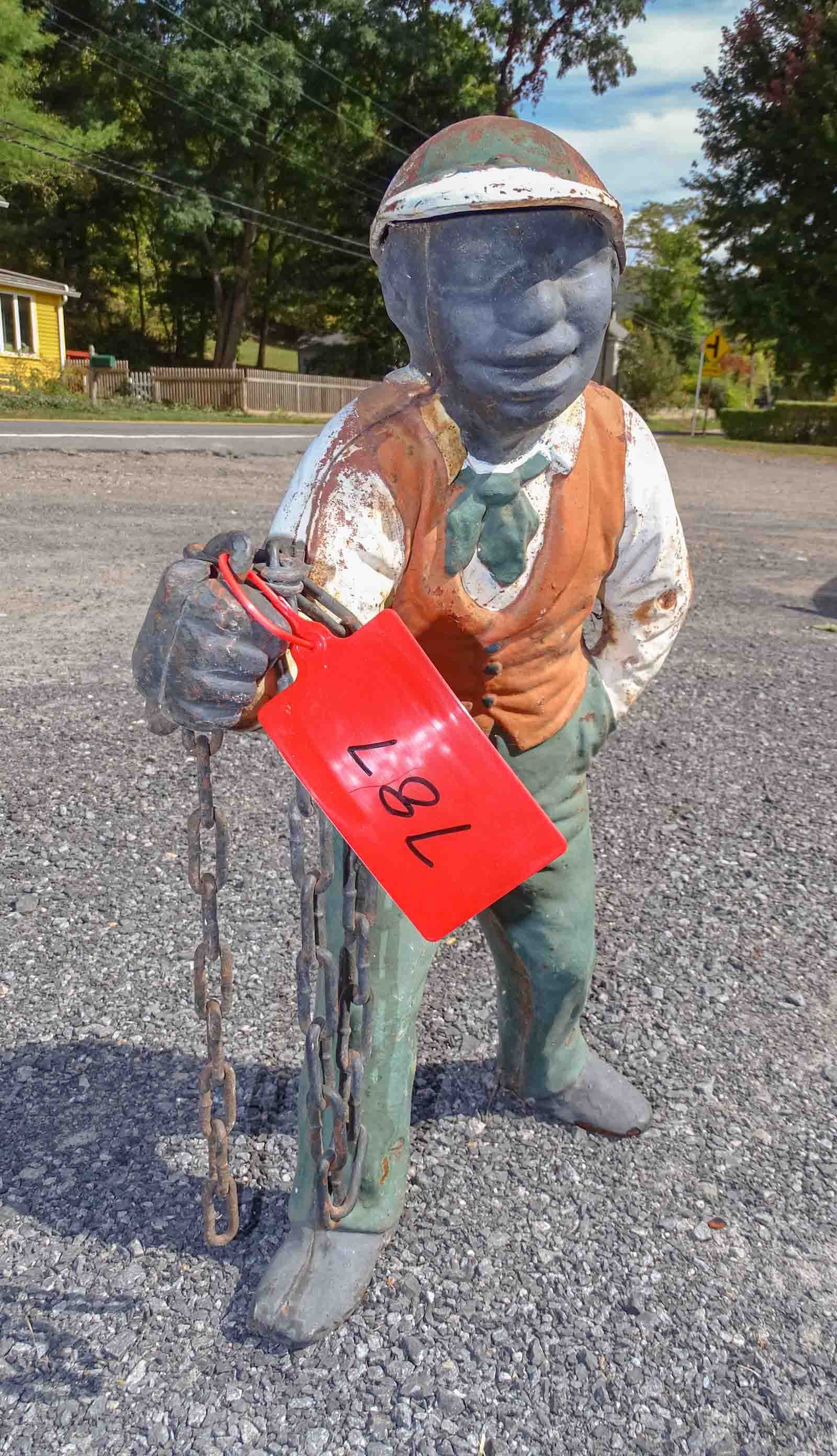 Cast Iron Jockey: Cast iron jockey. No base. 23" Ht. with chain.