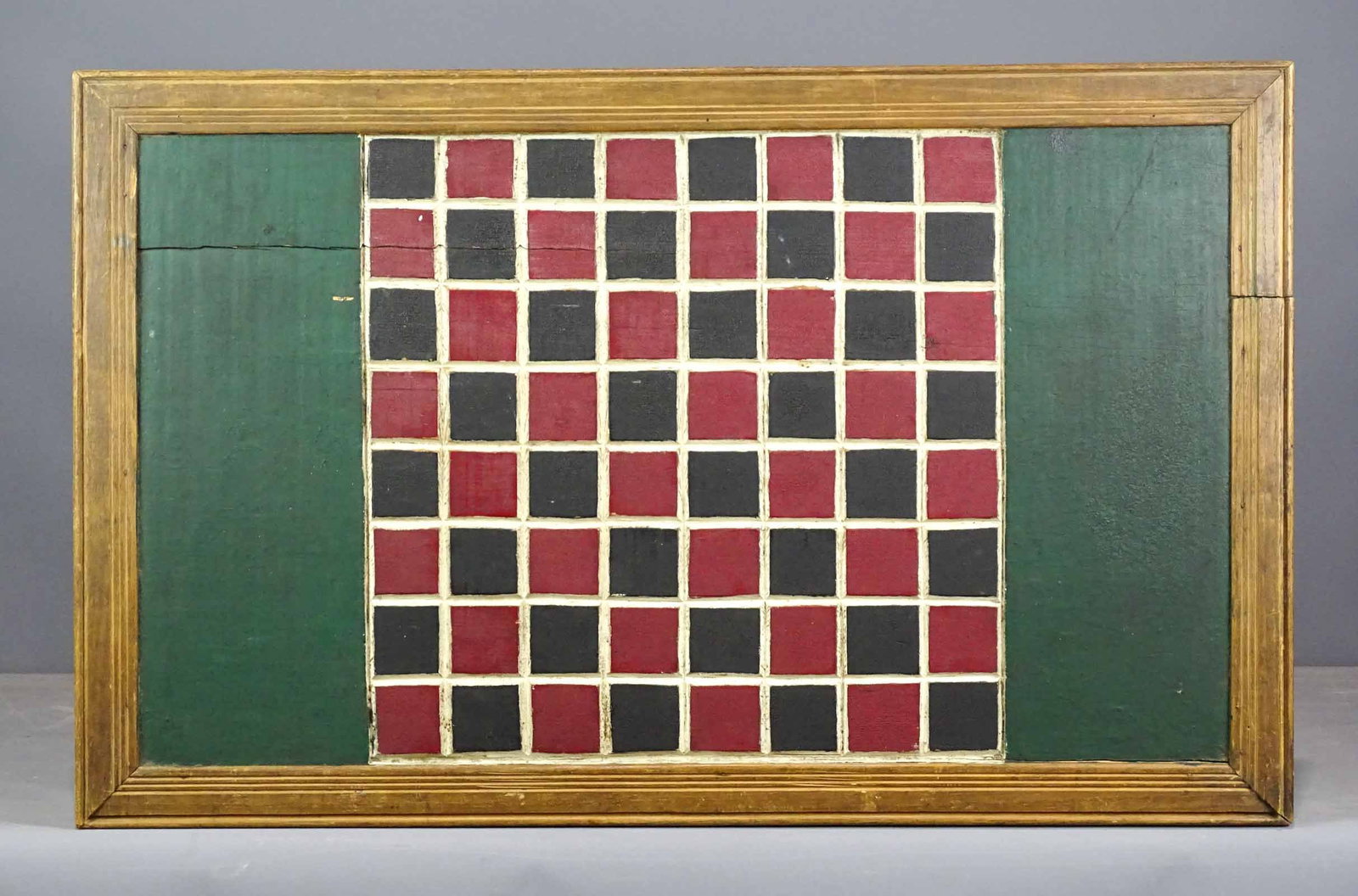 Game Board: Carved and painted wooden game board. 31" x 19".