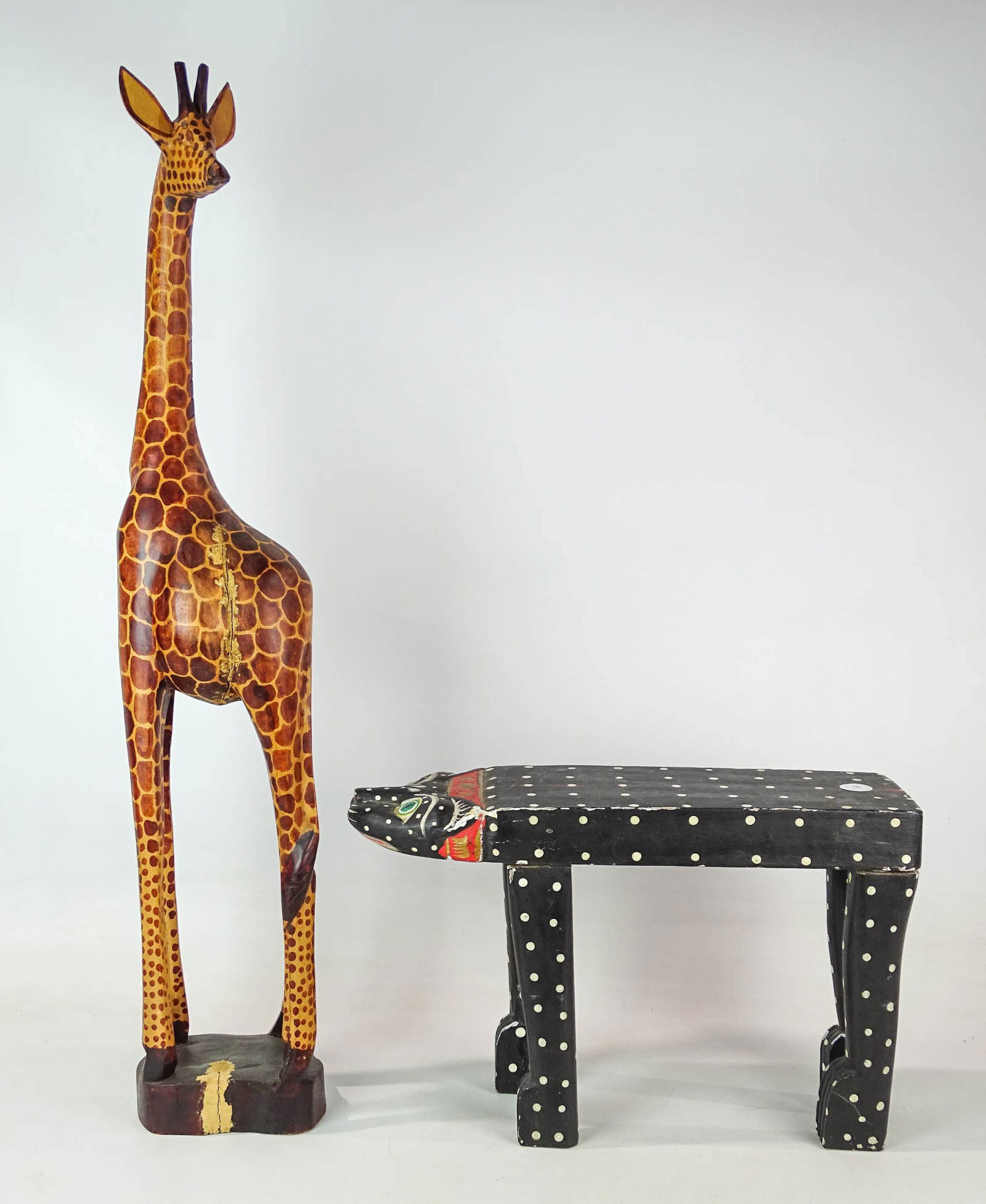 Carved Giraffe and Stool Lot: Lot including carved and painted wooden Giraffe. 36" Ht., and animal stool (19" L., 13" Ht.).