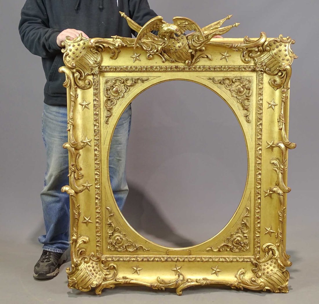 Rare 19th c. Plasterwork Frame: Rare and important 19th c. plasterwork frame with eagle shields, flags etc.. American C. 1850. Overall size 41" x 36". Note label on front marked Gilbert Stuart. Sight of oval area 27 1/2" x 22 1/2",