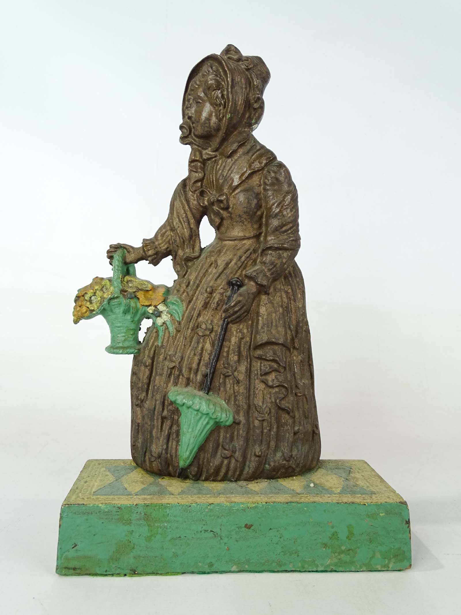 Bradley & Hubbard Doorstop: Signed cast iron Bradley and Hubbard doorstop. 12" Ht..