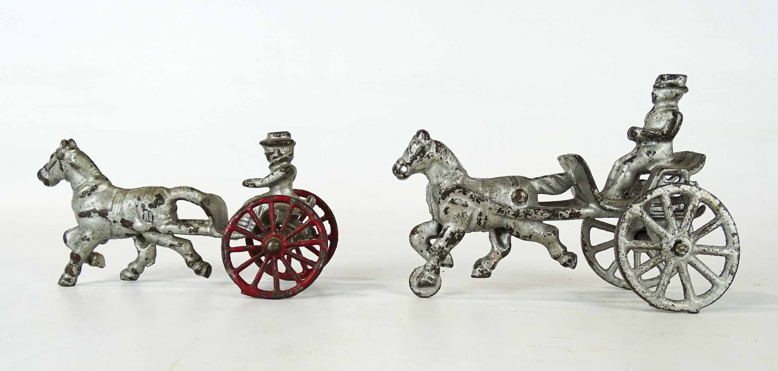Horse and Rider Toys: Lot (2) cast iron horse and rider toys. 5" and 5 1/2" L..