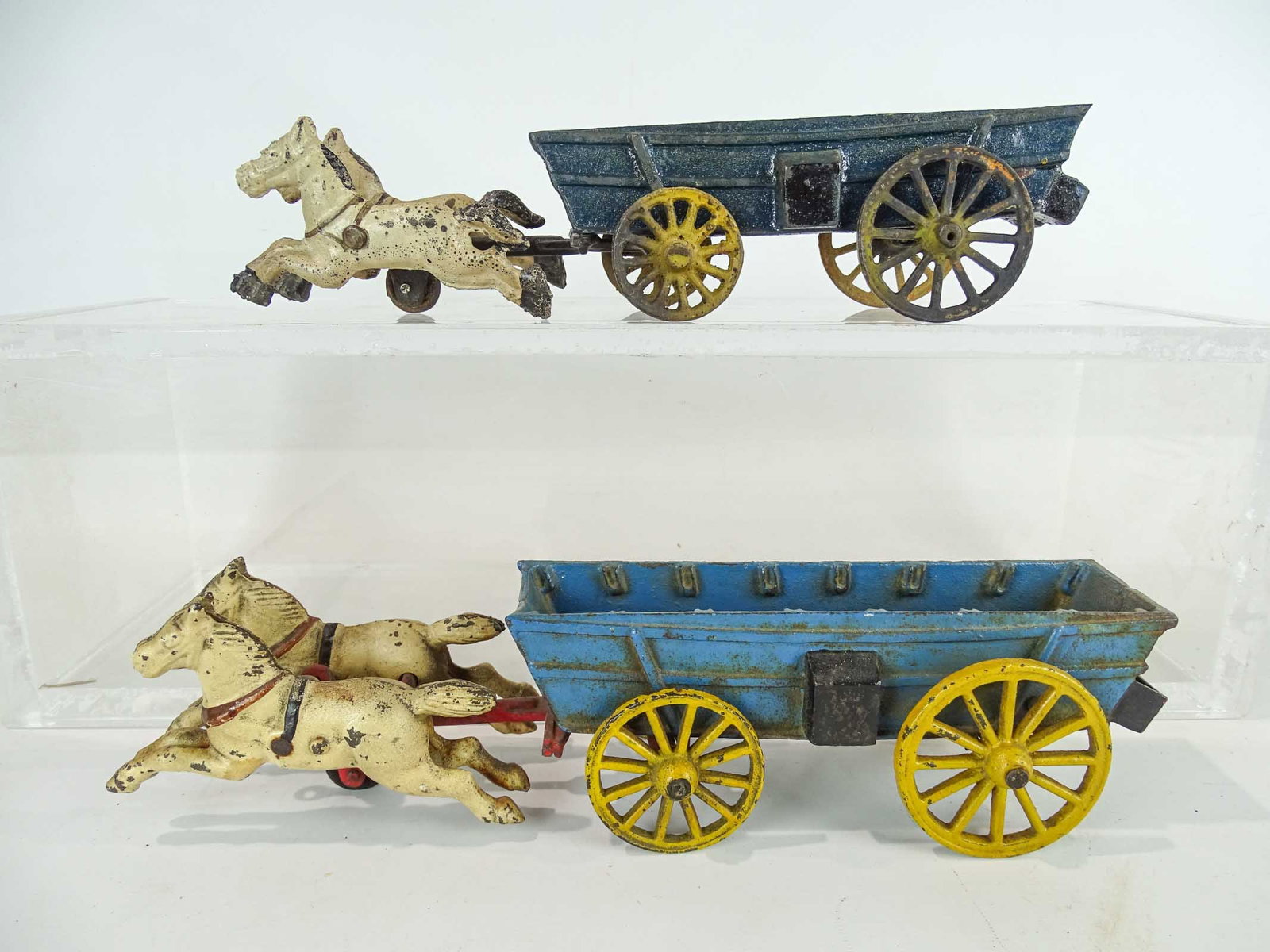 Horse and Wagon Toys: Lot (2) cast iron horse and wagon toys. 12" and 12 1/2" L..