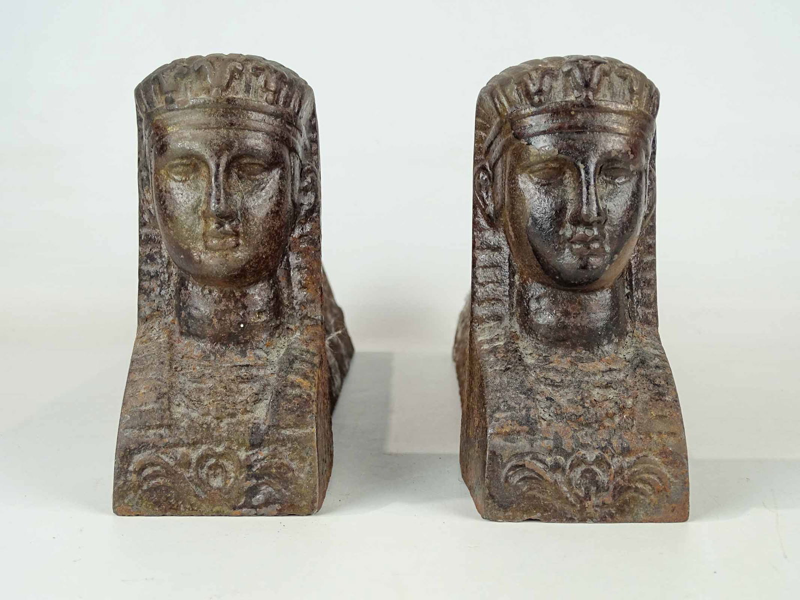 Pair Egyptian Revival Andirons: Pair cast iron Egyptian Revival andirons. 13" L., 6" Ht..