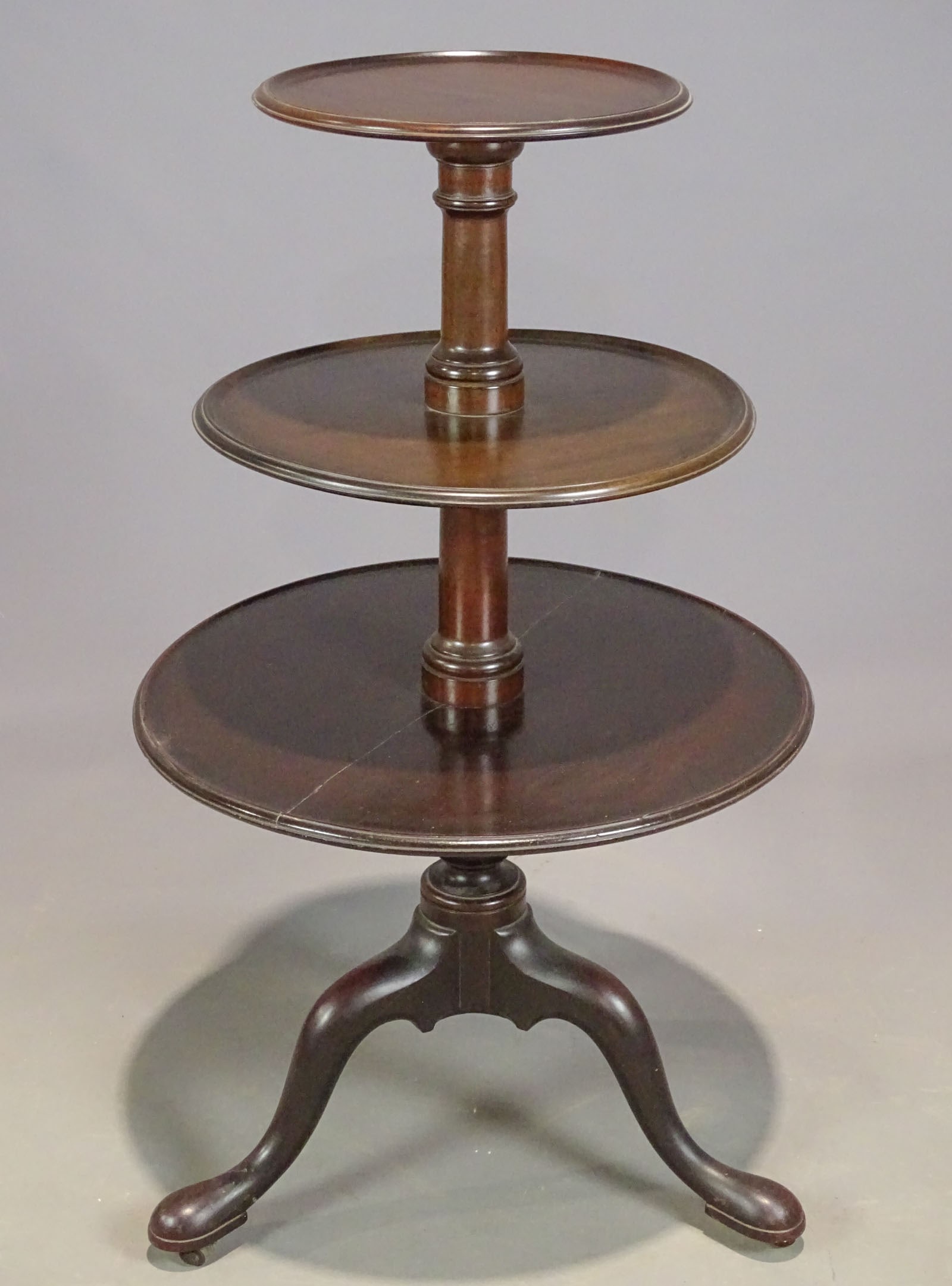 18th c. Mahogany Dumbwaiter: 18th c. Mahogany Dumbwaiter with three graduated, revolving tiered shelves with molded tray edge, supported by turned columns raised on a tripod base with cabriole legs raised on pad feet terminating 