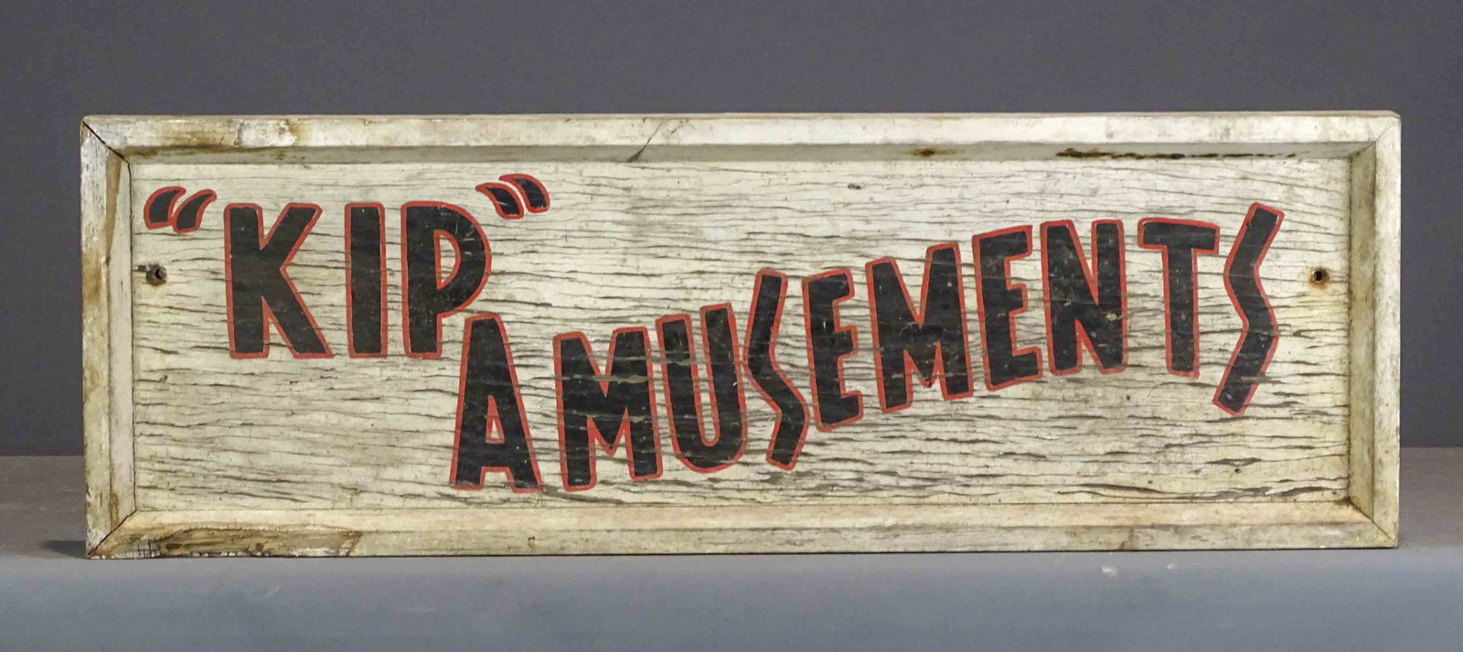 Trade Sign: Painted wooden trade sign "KIP" AMUSEMENTS". 12" x 36".