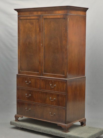 Linen Press: Mahogany two door over four drawers two part linen press. 45" W 22 1/2" D 82 1/2" Ht.