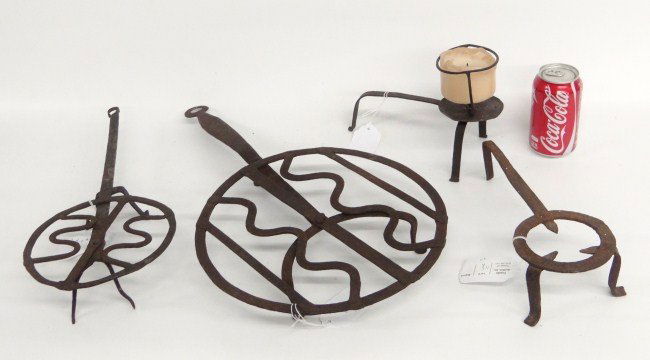 Iron Lot: Early iron lot including two rotating broilers, trivet and lamp. 8" to 21" Length.