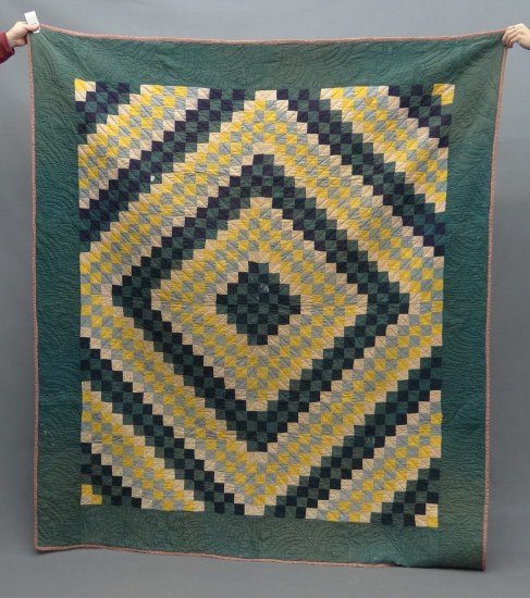 Quilt: Early Amish Sunshine and Shadows quilt. 73" x 83". Some damage to field.