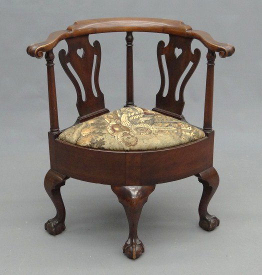 Corner Chair: Chippendale style mahogany corner chair with ball and claw feet and carved knuckle arms. 18" Seat Ht. 32" Overall Ht.