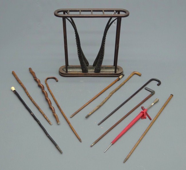 Victorian Cane Rack: Victorian cane rack with Ibis horns, 26" Ht., 25" Length. Includes selection of 10 canes including leather ring example, alligator carved, 1939 N.Y. World's Fair, Adirondack hoof handle etc.