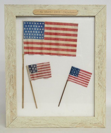 Early American Flags: Lot three American stick flags including 1876 Seven Star, 1876 13 Star and 1908 46 Star.