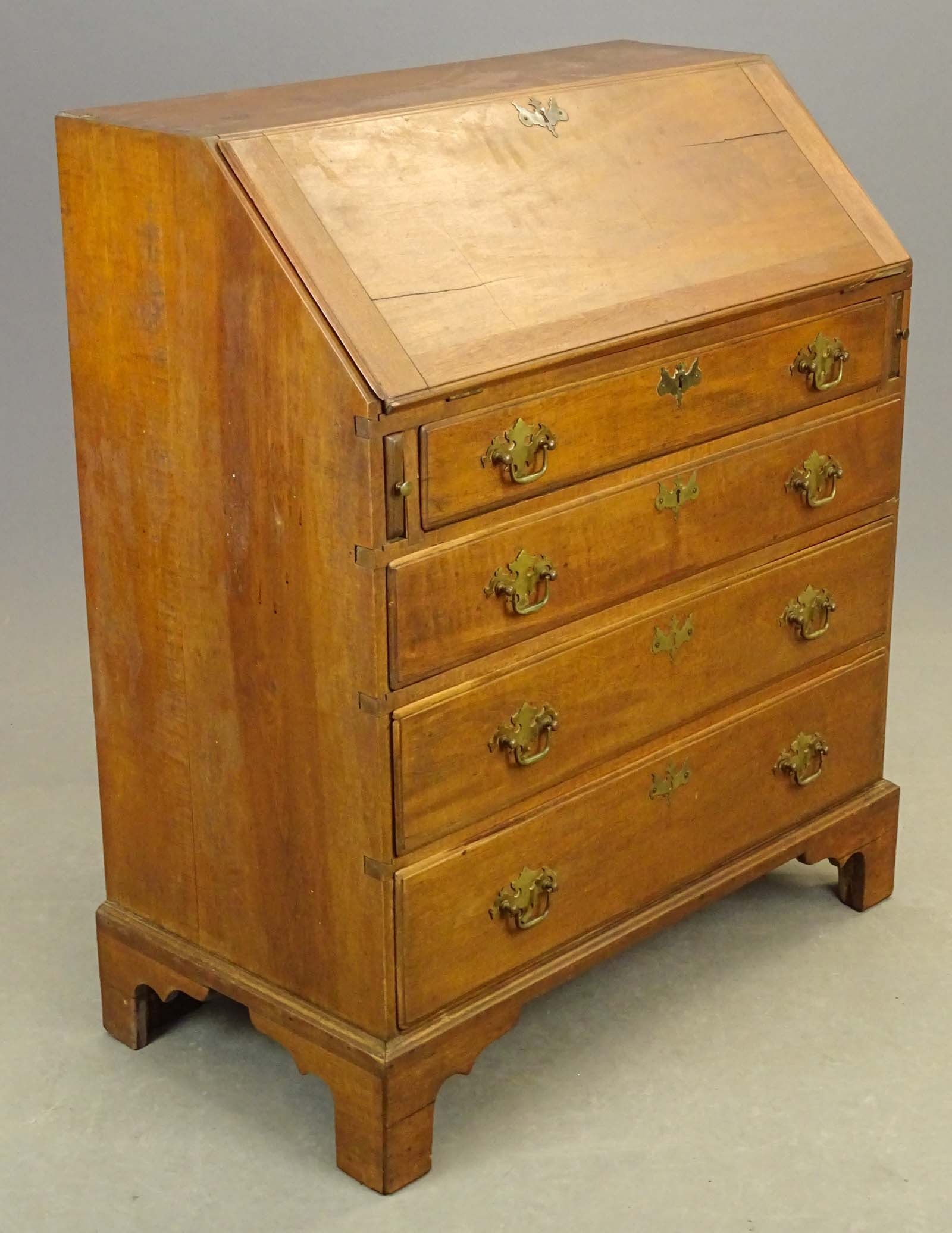 18th c. New England Slant Lid Desk: 18th c. Chippendale New England slant lid bracket base desk with (4) drawers. Fitted interior. 34" x 18" x 41".