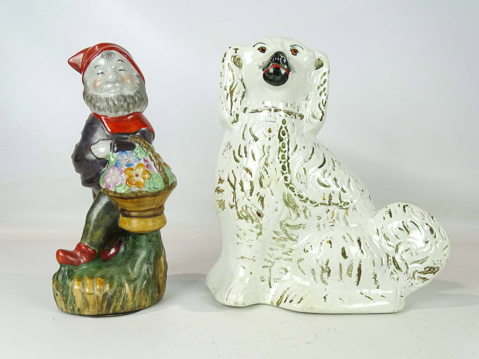 Ceramic Lot: Lot: 13 1/2" Staffordshire spaniel; 13" Gnome walking man with basket.