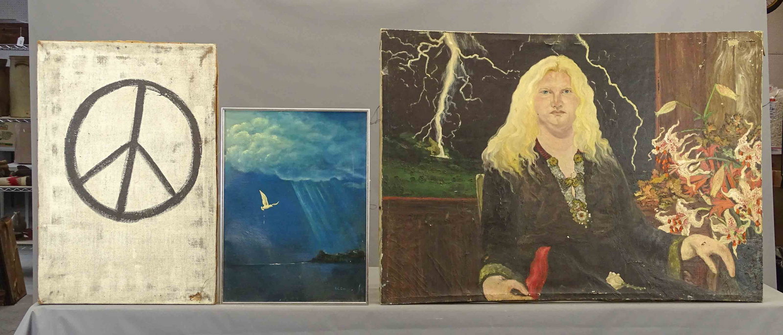 Artwork Lot: Artwork lot including: Peace Sign (oil on canvas, 32" x 21 1/2"), H.C. Cox, bird in flight, info verso, oil on artist board (overall 24" x 18 1/2"), portrait of a woman (oil on canvas, 34" x 49").