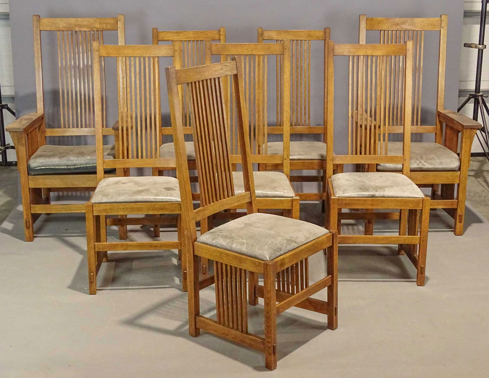 Stickley (Audi) Chairs: Stickley (Audi) Arts and Crafts Mission oak chairs. (6) sides and (2) arms. All with leather seats. Armchairs 48 1/2" Ht., 19" seat Ht., sides 46" Ht., 19" seat Ht..