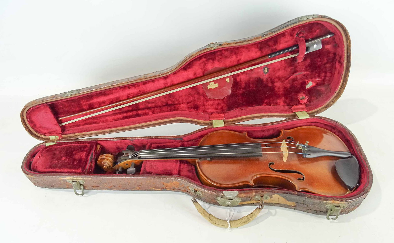 Violin: Violin, full size from the Jackson Guldan Violin Co., Cleveland, equipped with Novutny Ohio fingerboard device, C. 1924 (device is removable by a luthier), length over body 14", with case and pernambu