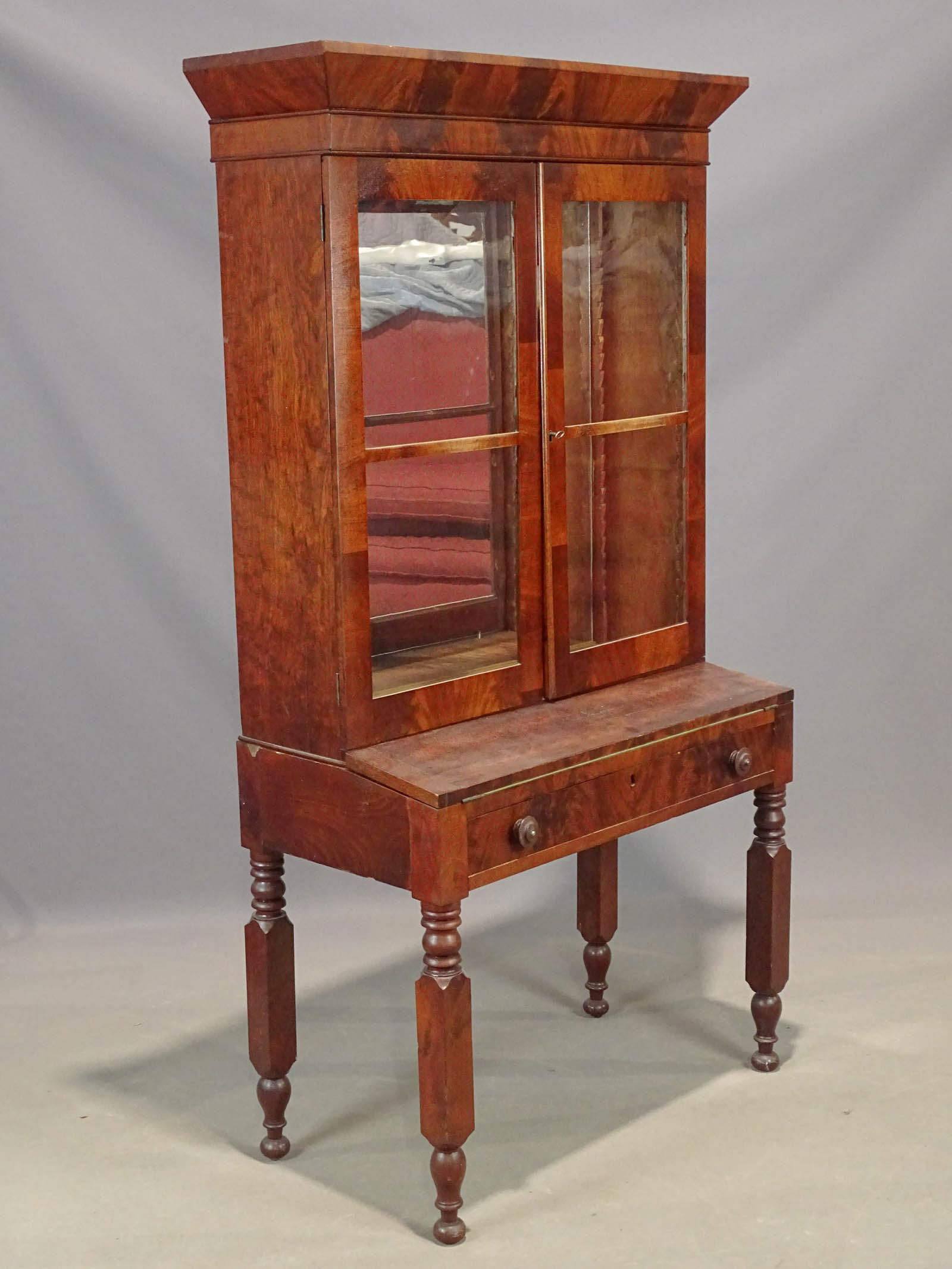 19th c. Secretary: 19th c. New York leg two part late Empire mahogany secretary. 36" x 19" x 71 1/2".