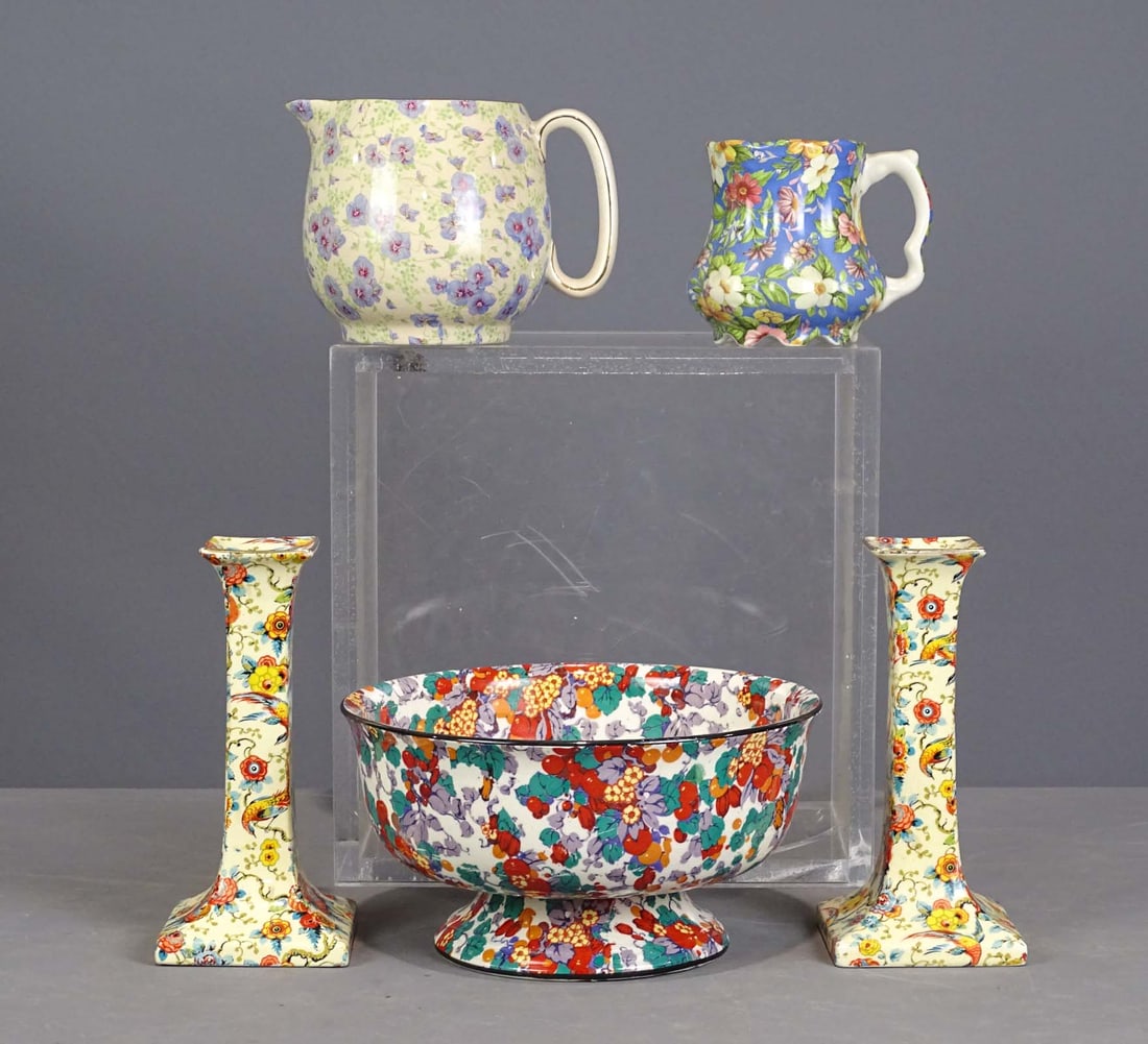 Chintz Pottery Lot: Lot of Chintz pottery including pair of Royal Winton candlesticks (8" Ht.), Lord Nelson Pansy pitcher (5" Ht.), Crown Ducal bowl (9" D., 5" Ht.), Staffordshire Chintz pitcher (4 1/2" Ht.). Good condit