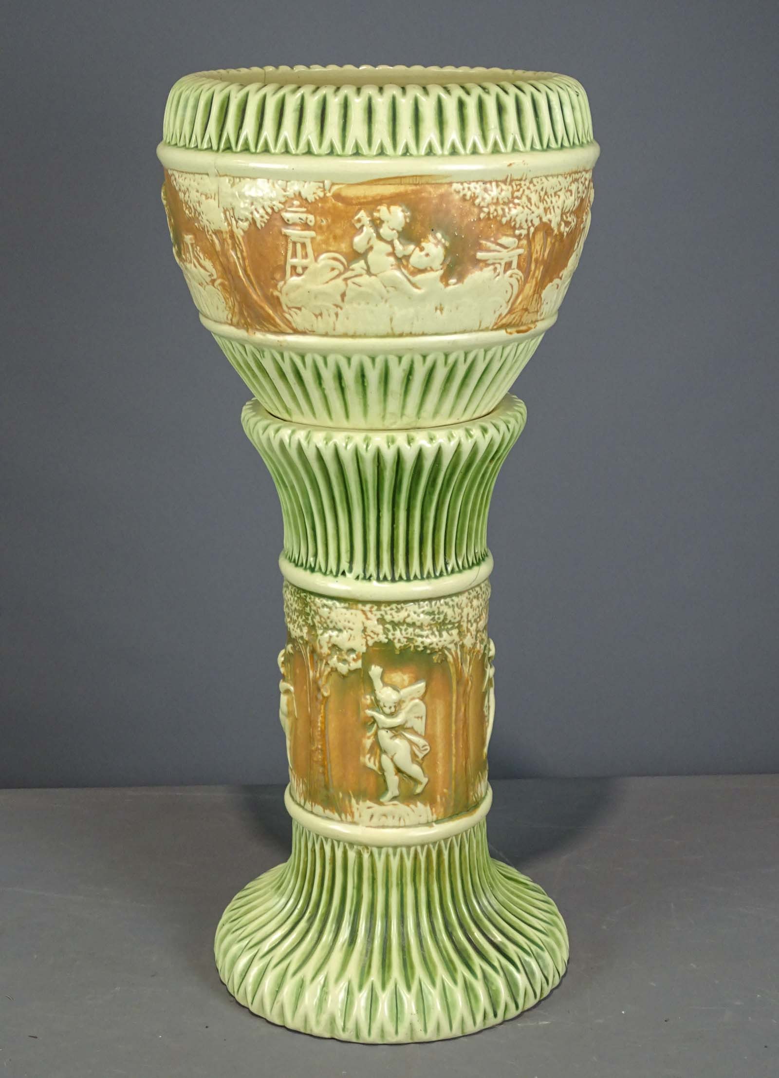 Roseville Jardiniere and Pedestal: Roseville Jardiniere and pedestal. Barbara Packer Collection. 28" Ht.. Base has crack (middle), top has cracks throughout.