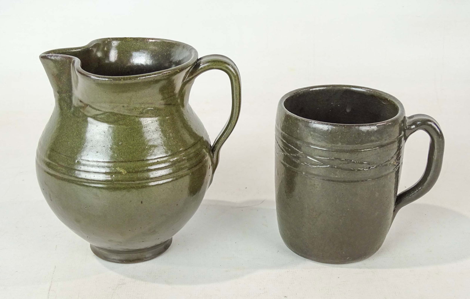 Jugtown Pitcher and Mug: Jugtown signed pitcher and mug. Tallest 5 1/2" Ht..