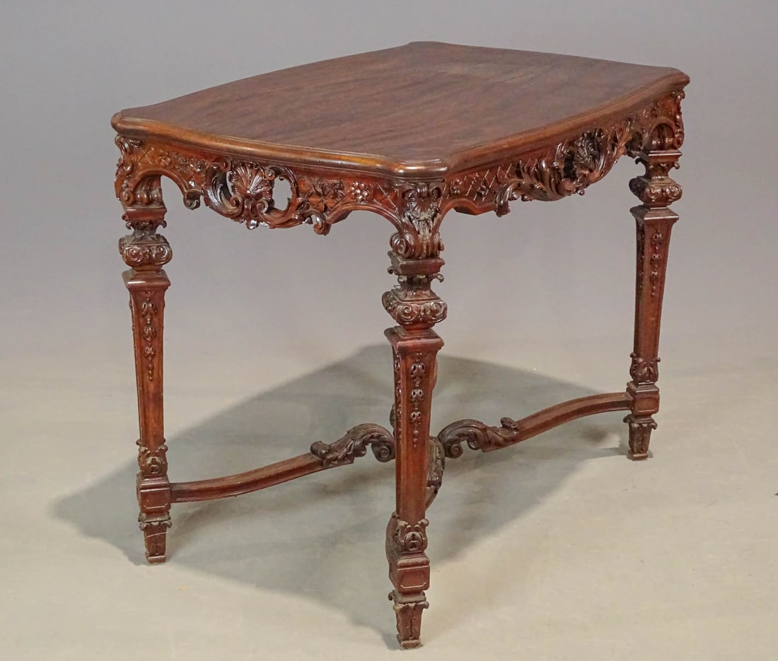 19th c. Portuguese Table: 19th c. carved mahogany Portuguese center table. 38" x 25" x 31".
