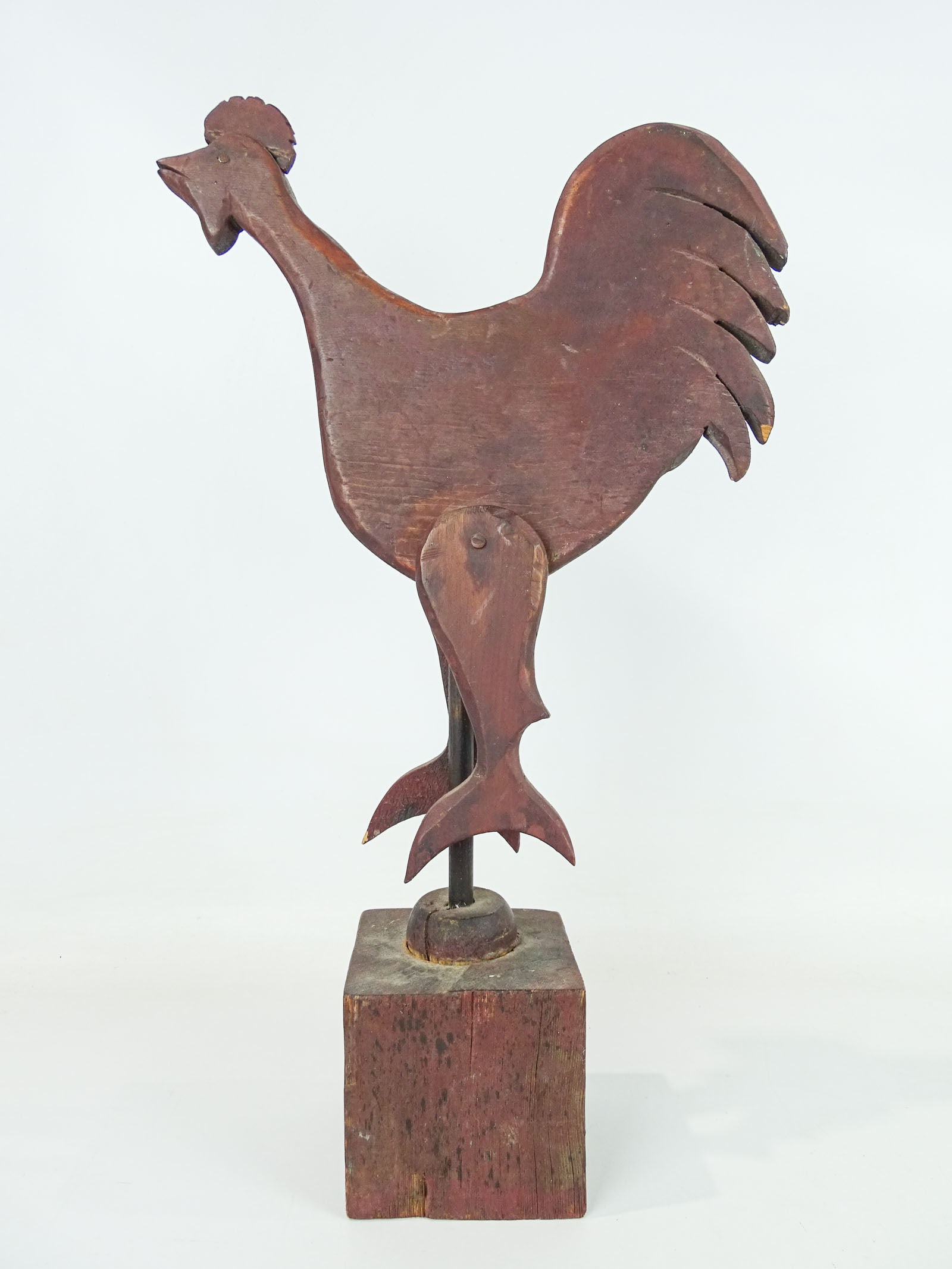Folk Art Wooden Rooster: Folk art wooden rooster in red paint. On wooden base. 21" Ht..