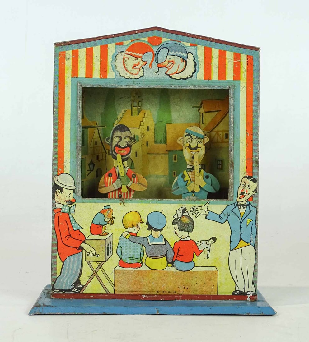 German Tin Litho Punch & Judy Toy: German tin litho Punch and Judy theater toy. 8" W., 10" Ht..