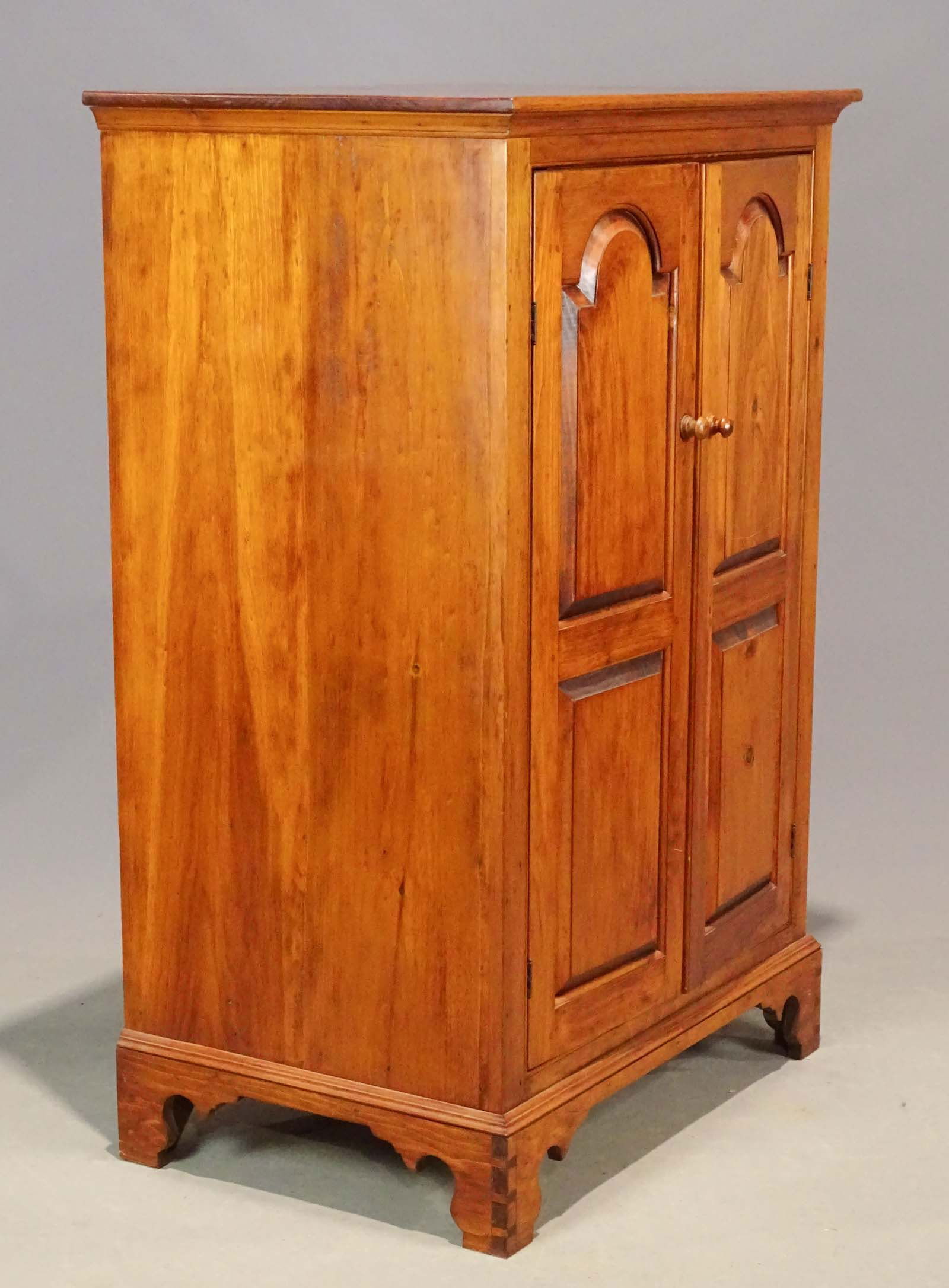 D.R. Dimes Wine Cabinet: D.R. Dimes pine two door wine cabinet. Dovetailed base. Interior wine racks. 36" x 24" x 55" Ht..