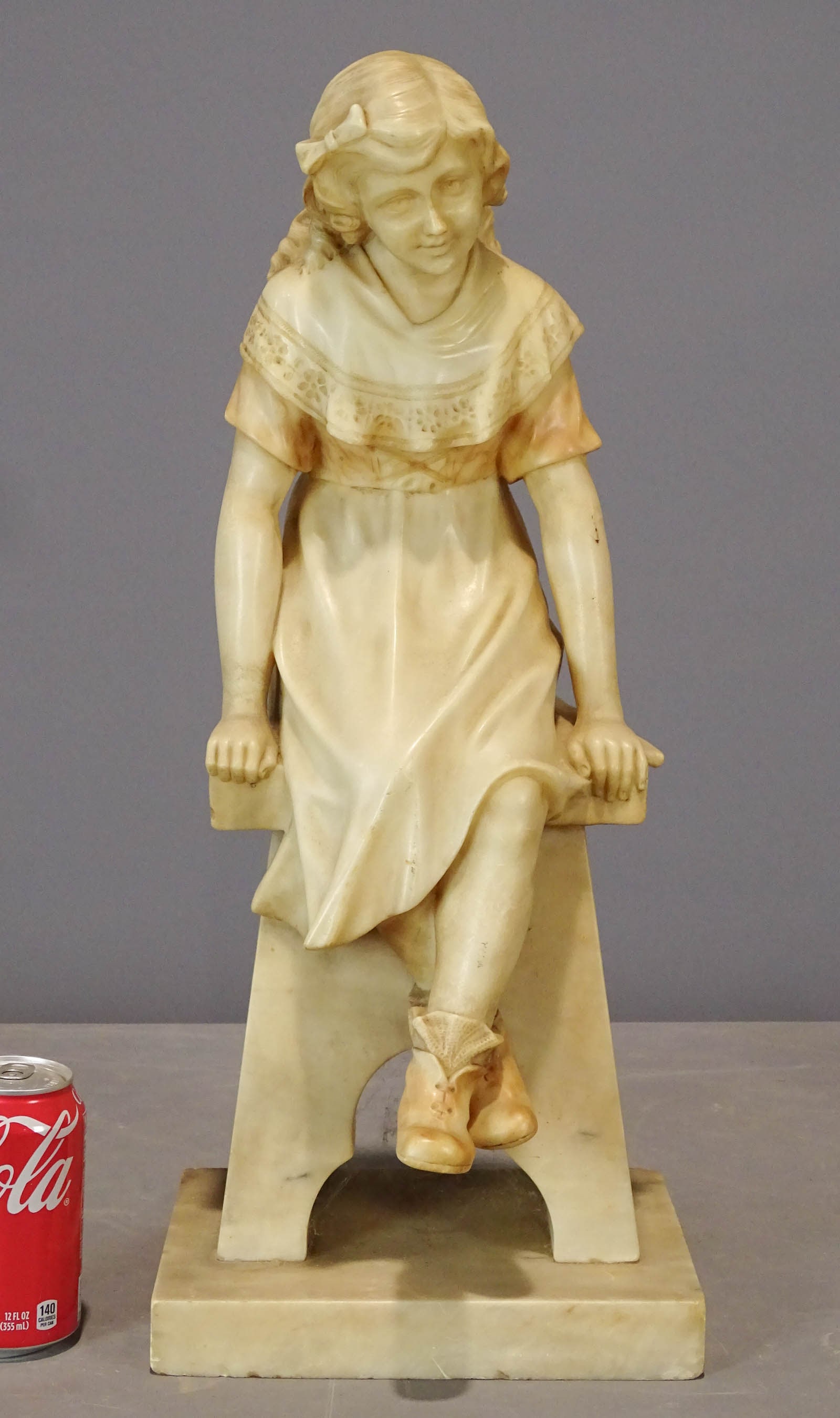 Marble Statue: Marble statue of a girl. 22" Ht.. Small chip to front foot.