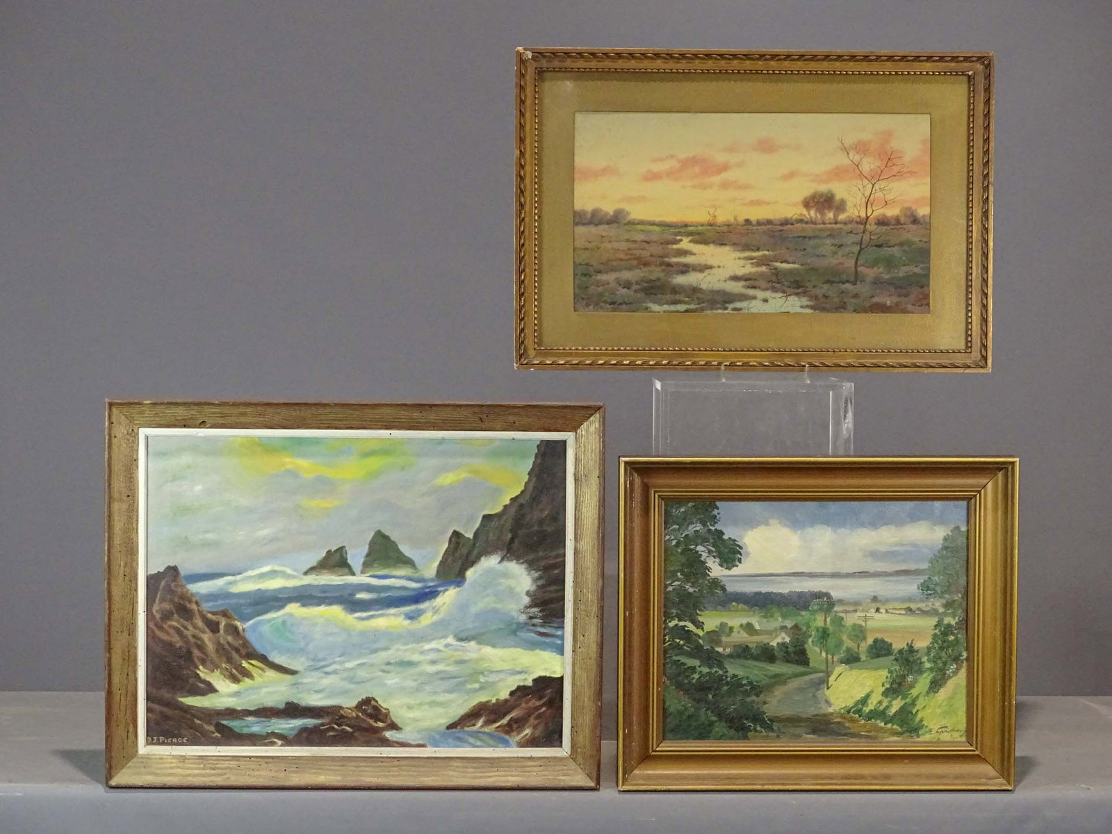 Artwork Lot: Artwork lot including: Seascape signed D.J. Piece (oil on canvas, overall 22" x 28"), landscape with river, signed LRC (oil on canvas, overall 19 1/2" x 22 1/2"), watercolor landscape signed "C.J. Hag