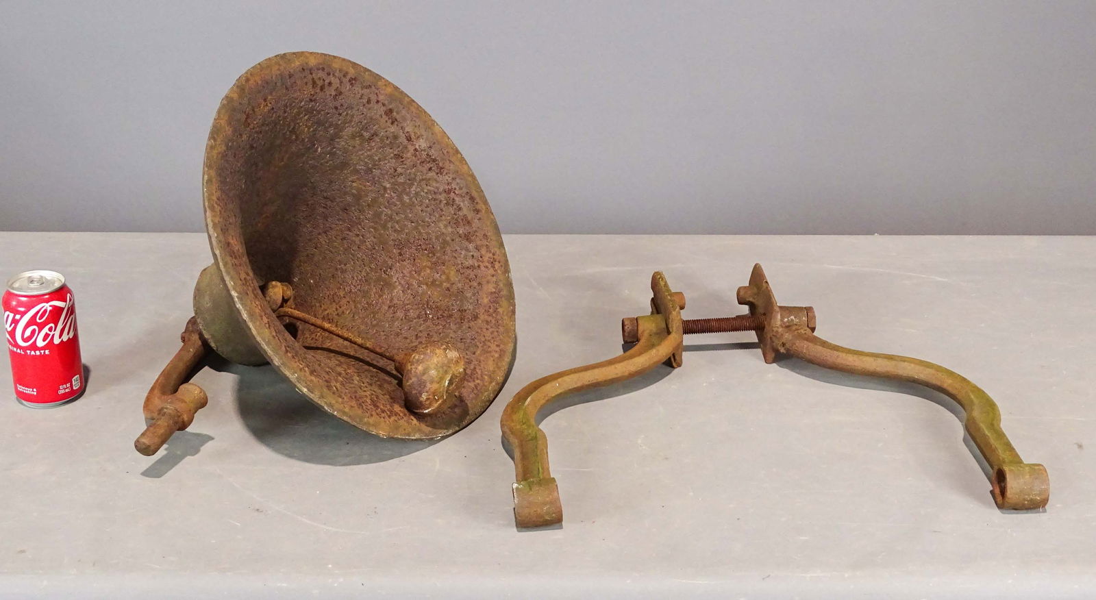 Cast Iron Bell: Cast iron bell with hanger.15 1/2" D., 14" Ht..