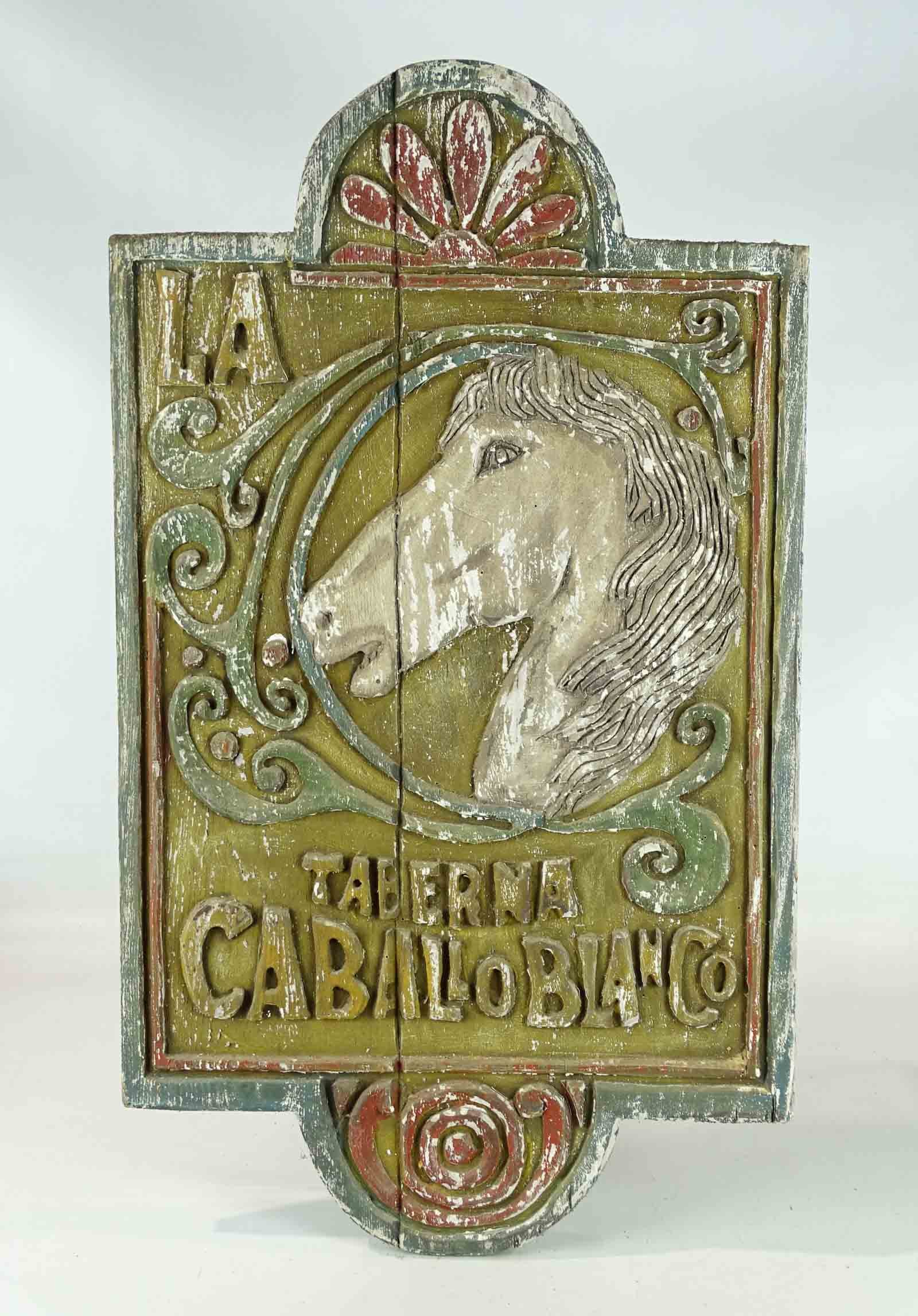Wooden Trade Sign: Painted carved wooden trade sign "TABERNA CABALLO BLANCO". 33" x 19".