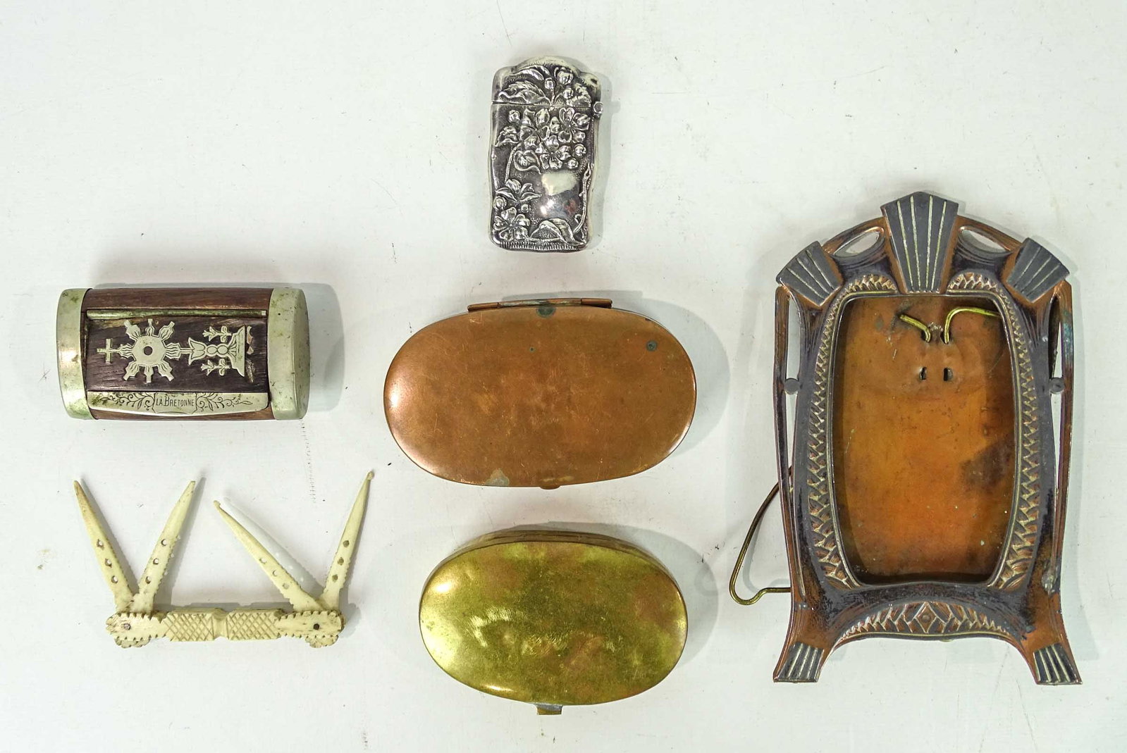 Misc. Lot: Lot including bone multi-tool, bronze frame (overall 6 1/2" Ht.), earl brass tobacco boxes, matchsafe, matchsafe marked "LA BRETONNE".