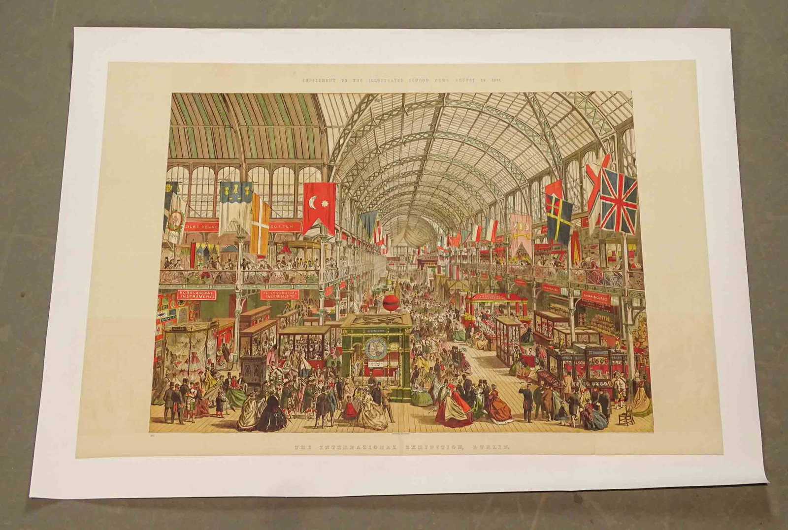 19th c. Print: Early print mounted to linen "SUPPLEMENT TO THE ILLUSTRATED LONDON NEWS AUGUST 19, 1869" (THE INTERNATIONAL EXHIBITON, DUBLIN"). Overall 25" x 35"