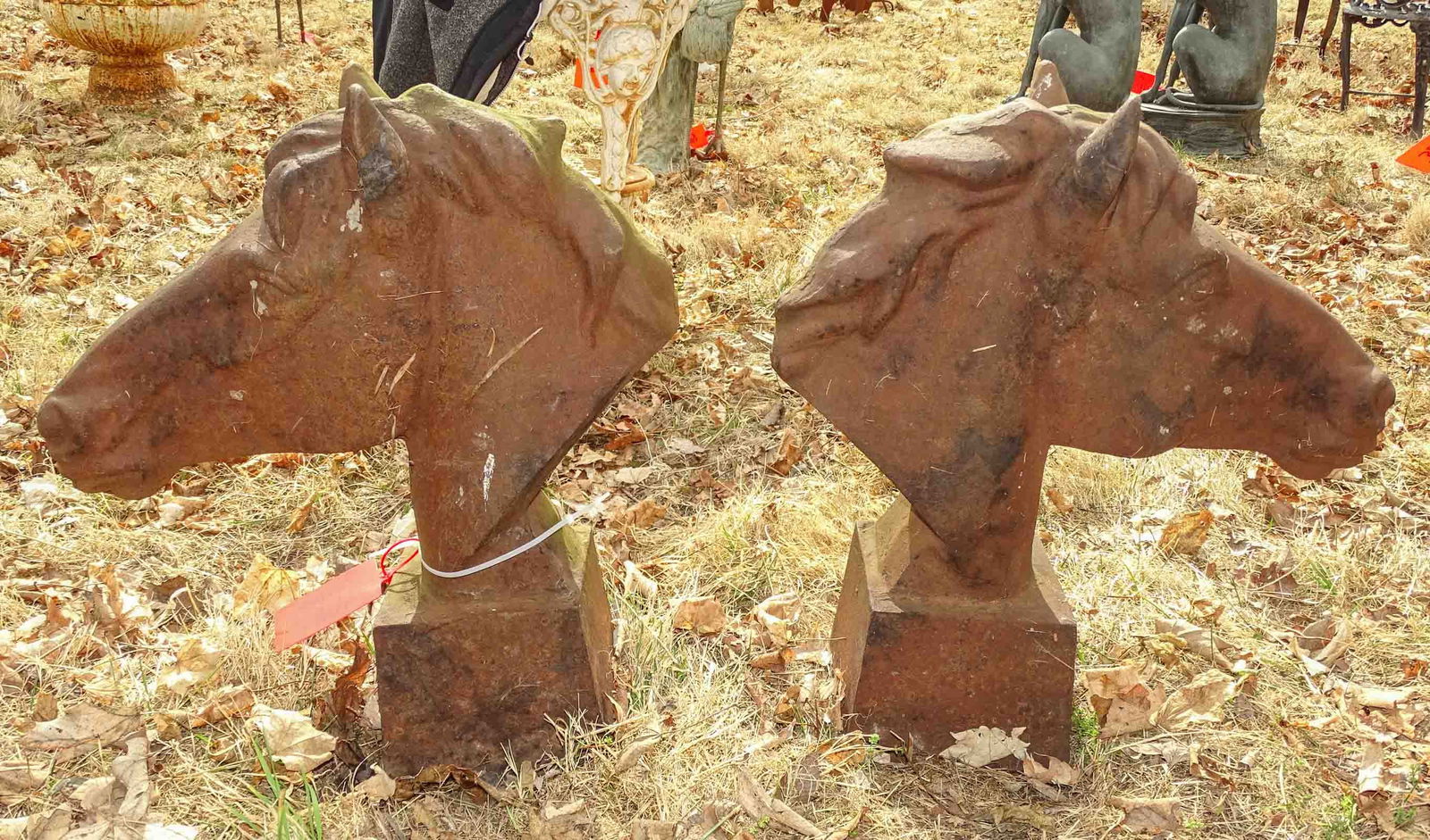 Cast Iron Horse Heads: Pair of cast iron horse heads. 24" ht, 20" w..