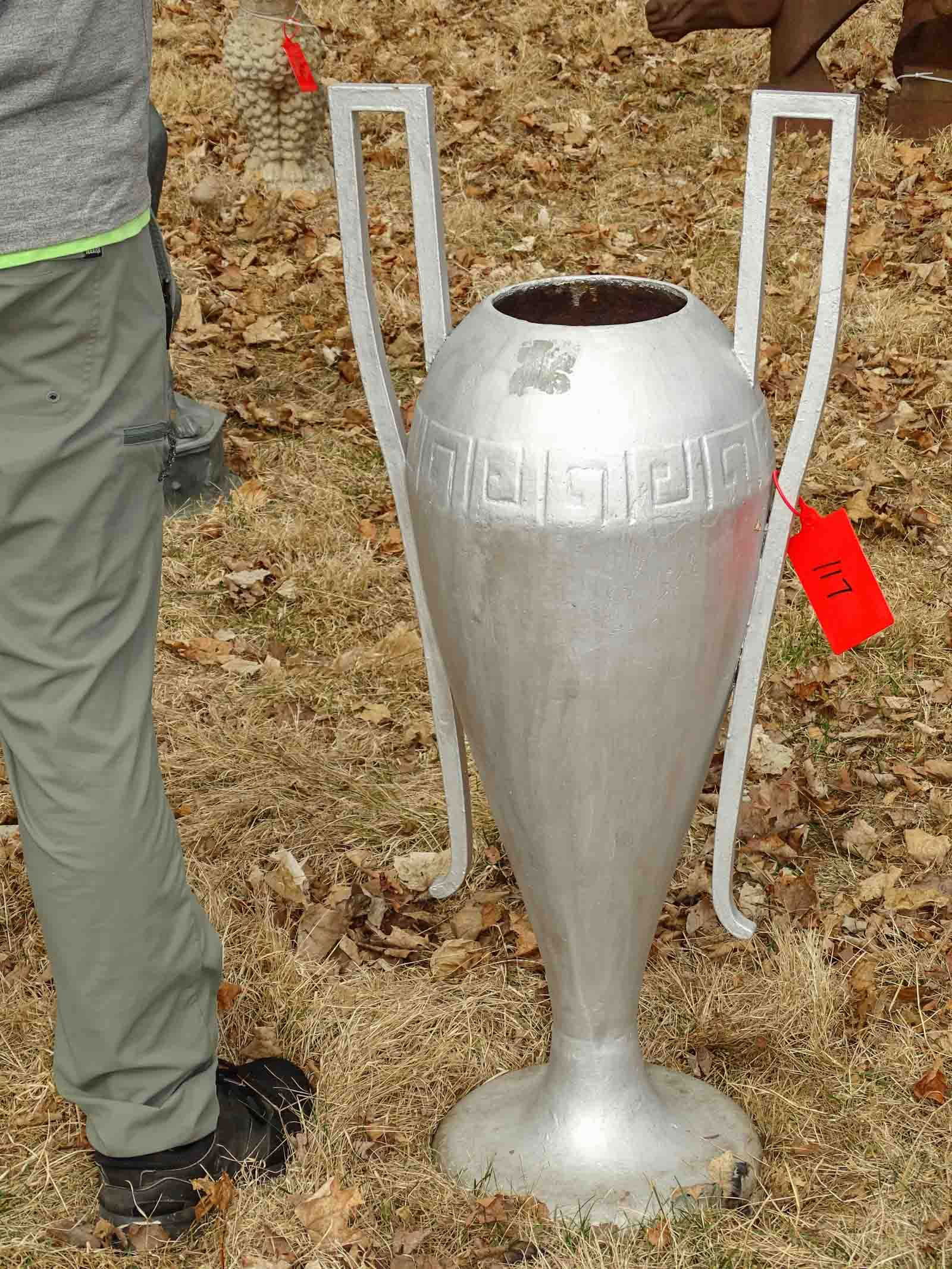 Urn: Cast metal silver urn with arms. 38" ht..