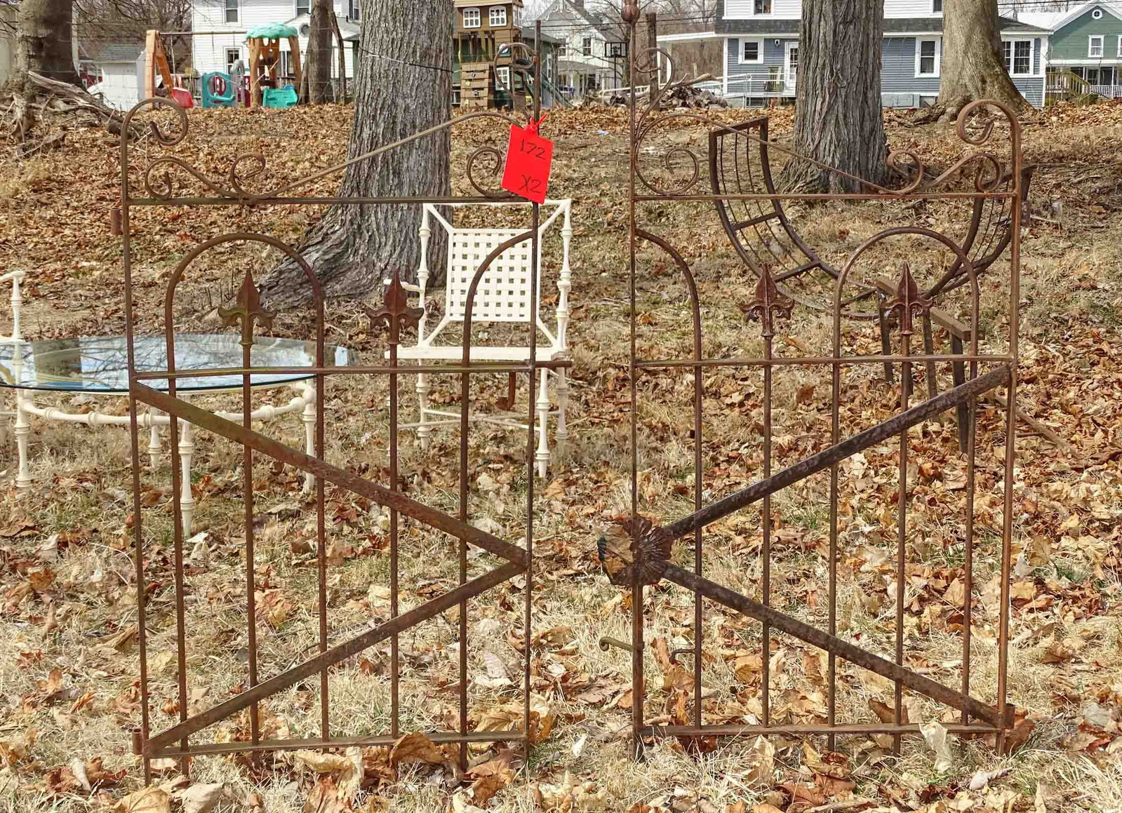 Gates: Iron gates. Tallest 54.5" ht.. 22" W..