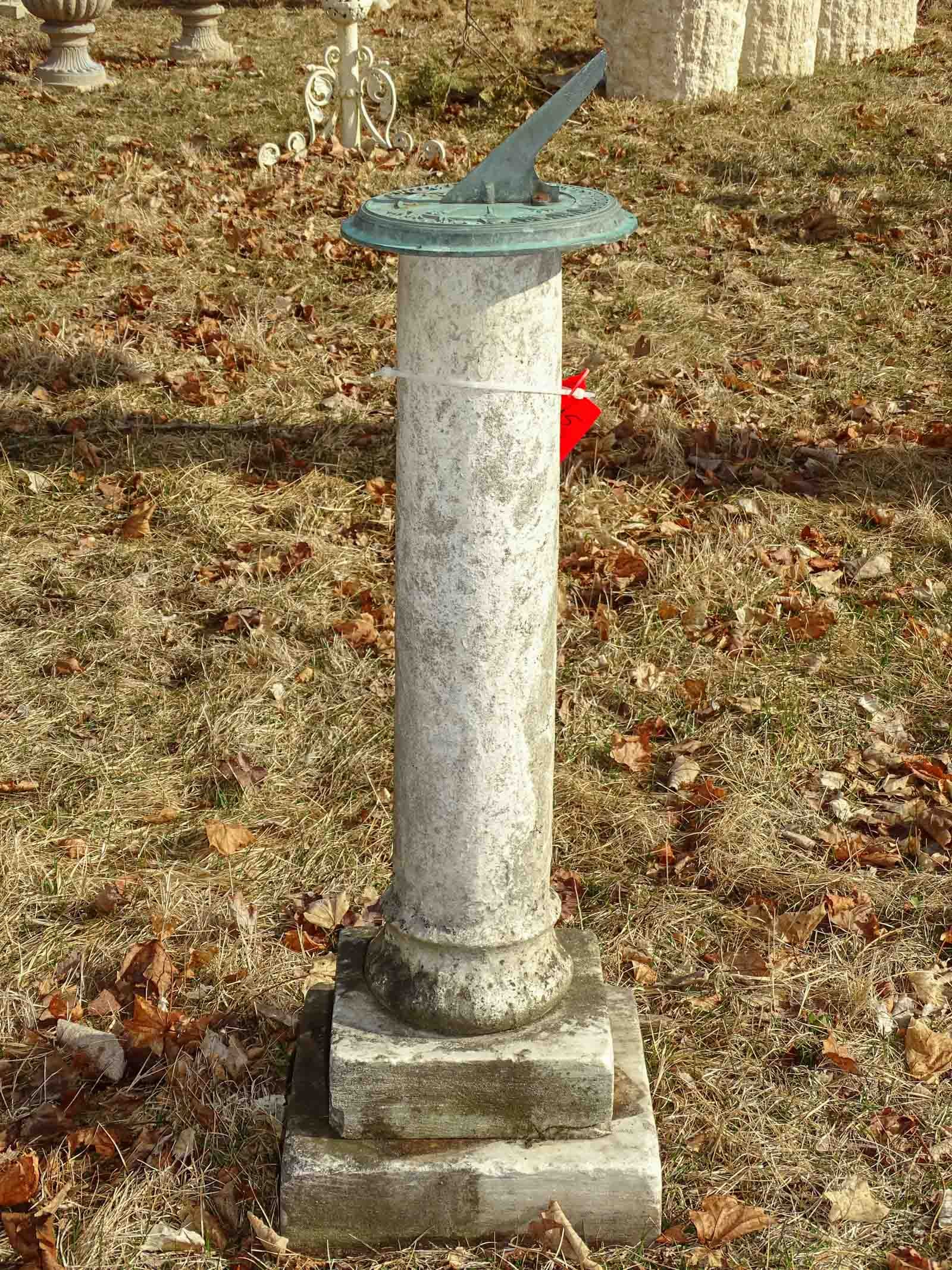 Sundial: Sundial, poured stone base and metal dial. 45" ht, 10" diameter.