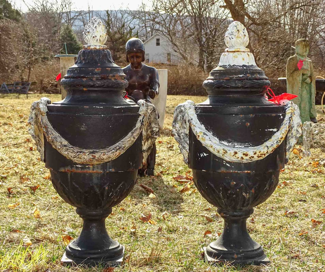 Urns: Pair of cast iron urns. 30" ht..