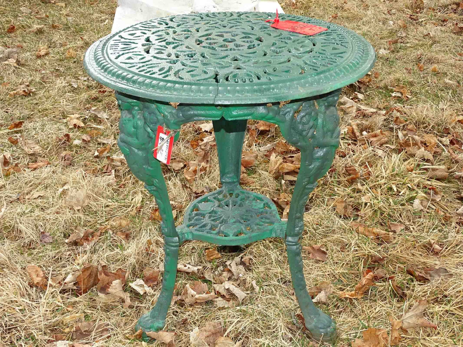 Cast Iron Table: Cast iron table. 25" ht, 22" diameter.