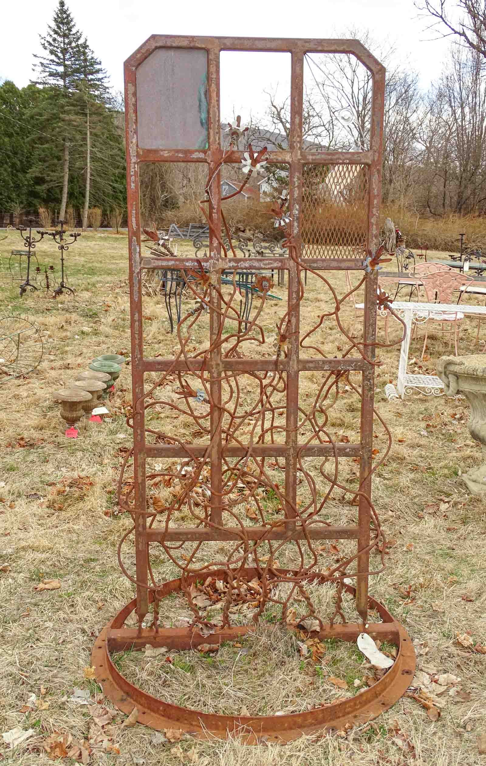 Trellis: Brutalist garden trellis signed "M. Januseski". 68" ht..