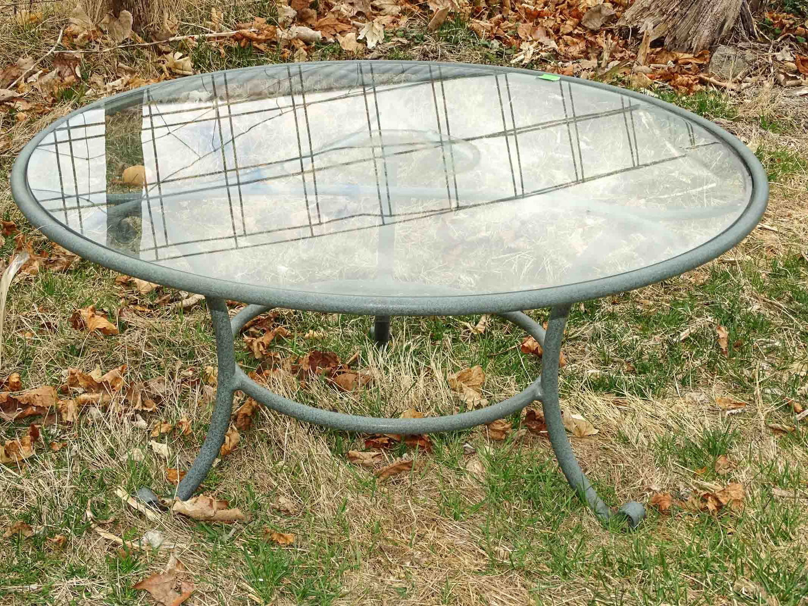 Coffee Table: Round glass top coffee table. 17" ht, 36" diameter.