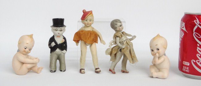 Bisque Doll Lot: Lot including two bisque Kewpie figures along with two dolls and figure in top hat.