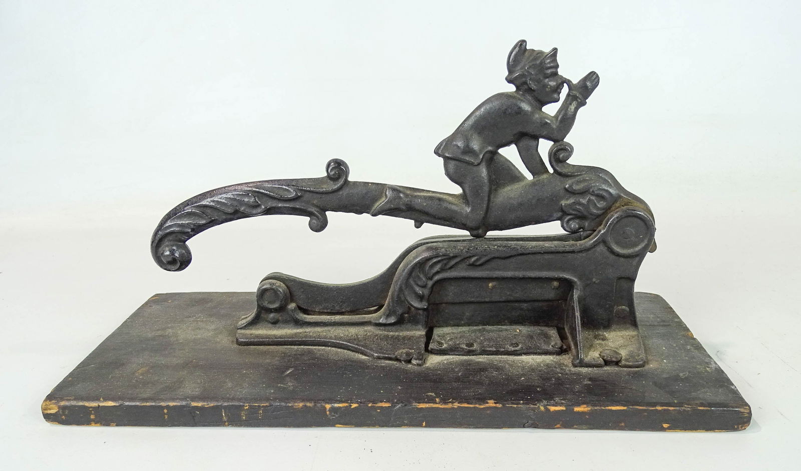 Tobacco Cutter: Figural iron wood base tobacco cutter. 16" x 6 1/2" x 9".