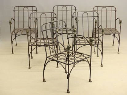 French Iron Patio Set: Scarce French iron patio set including (6) chairs (19" x 19" x 33" Ht., 16" seat Ht., and settee 72" x 33" x 40" Ht., 13" seat Ht.. Note bronze animal heads on arms.